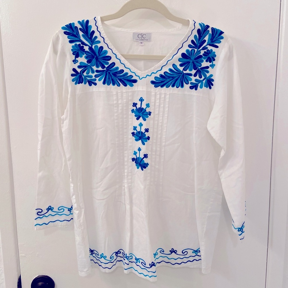 Beachy White top with blue flowers